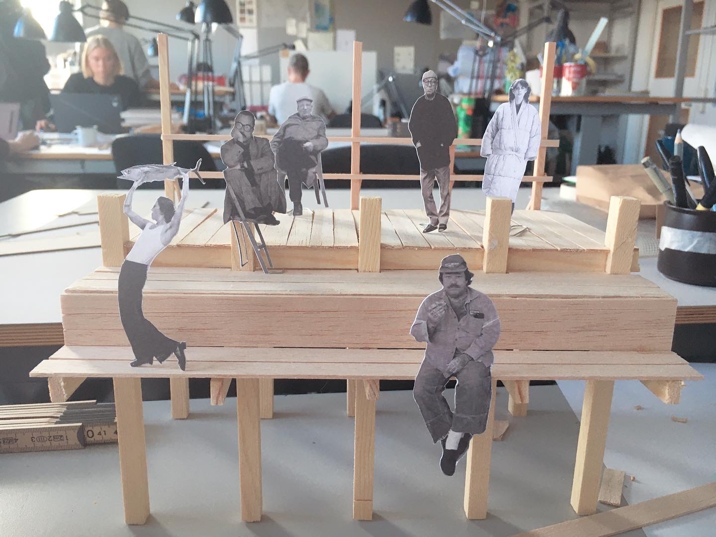 Physical model with collaged figures on the deck