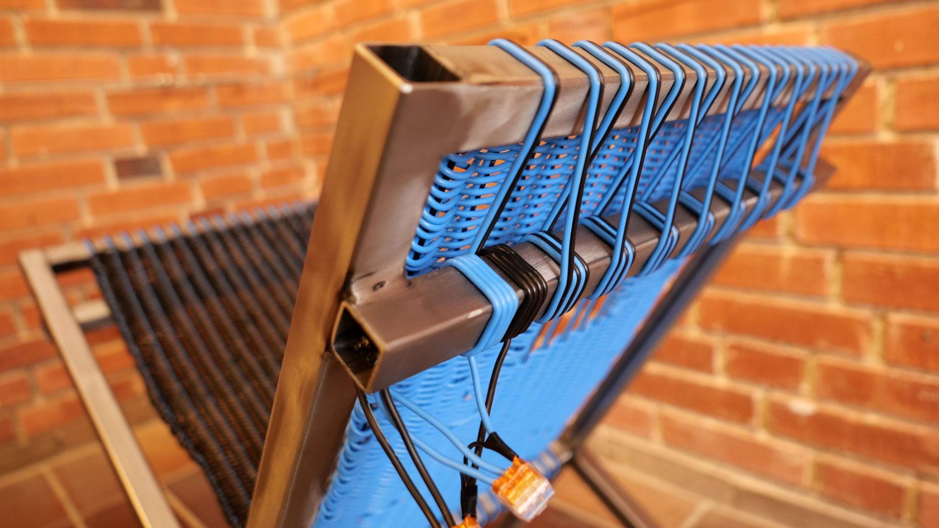 Stolen chair — close-up of blue woven backrest detail
